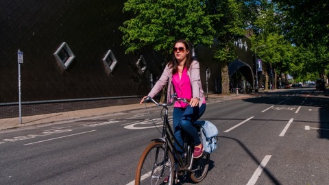 Female cyclist in cycle lane