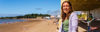 Image of a Walk Wheel Cycle Trust staff member, Hayley, with her e-bike on Barry Island.