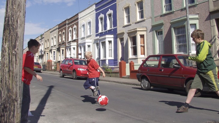 Children playing football in the street