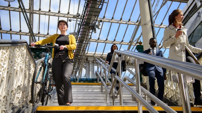 commuter walking bike down the steps at Waverley station