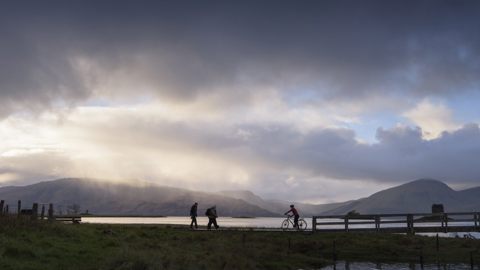 A Cyclist And Walkers On Caledonia Way 