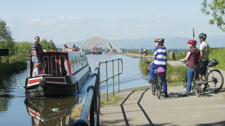 Family Cycling By Canal