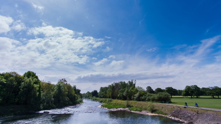River with cycle path going alongside it in park