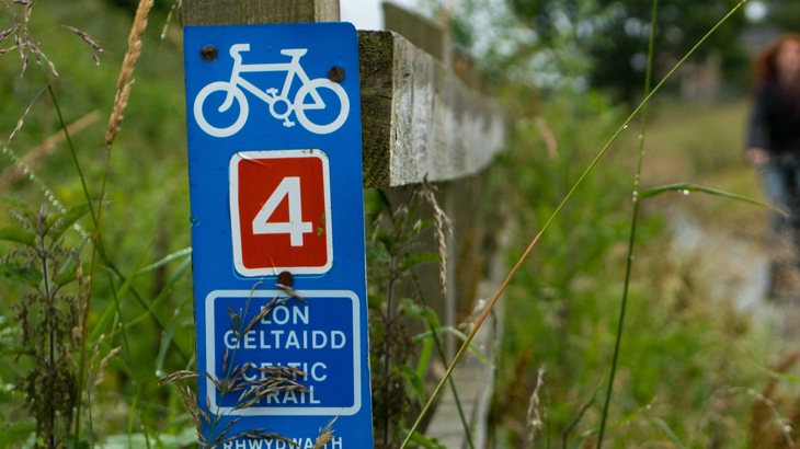 Celtic Trail sign, with two people on cycles, route 4, Wales