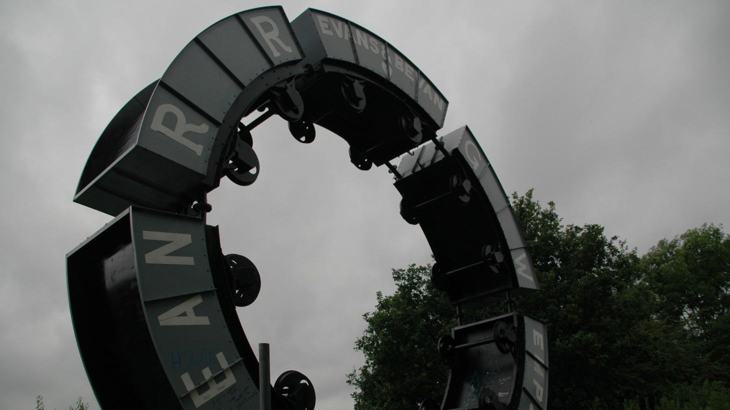 Circular metal sculpture made of train coal carriages