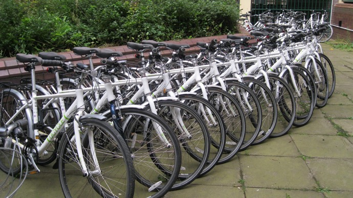 Row of hire bikes outside university building