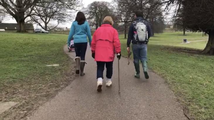 Jill walking with her family before her knee operation and cycling recovery