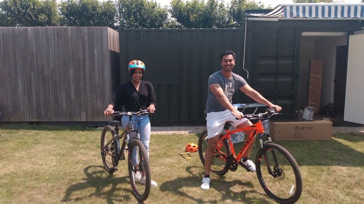 male and female sat on bicycles 