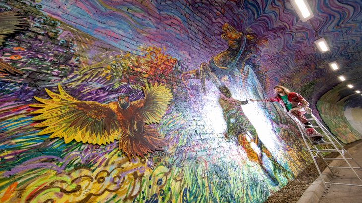Artist Chris Rutterford painting at the Colinton Tunnel, NCN 75. ArtRoots has supported the Colinton Tunnel project with funding.