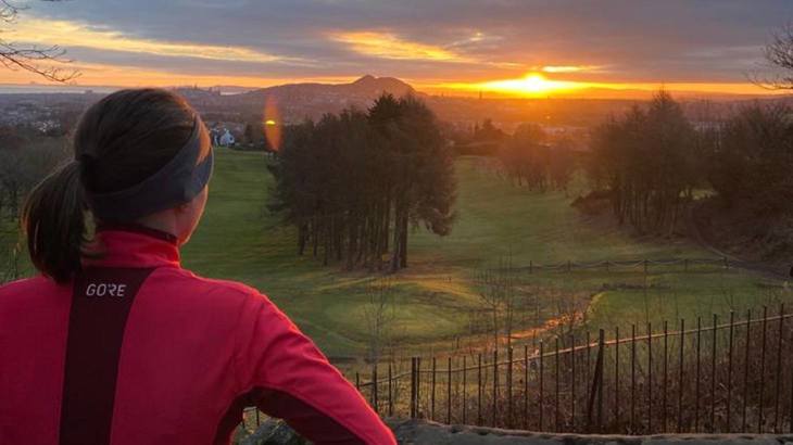 Woman looking at sunset 